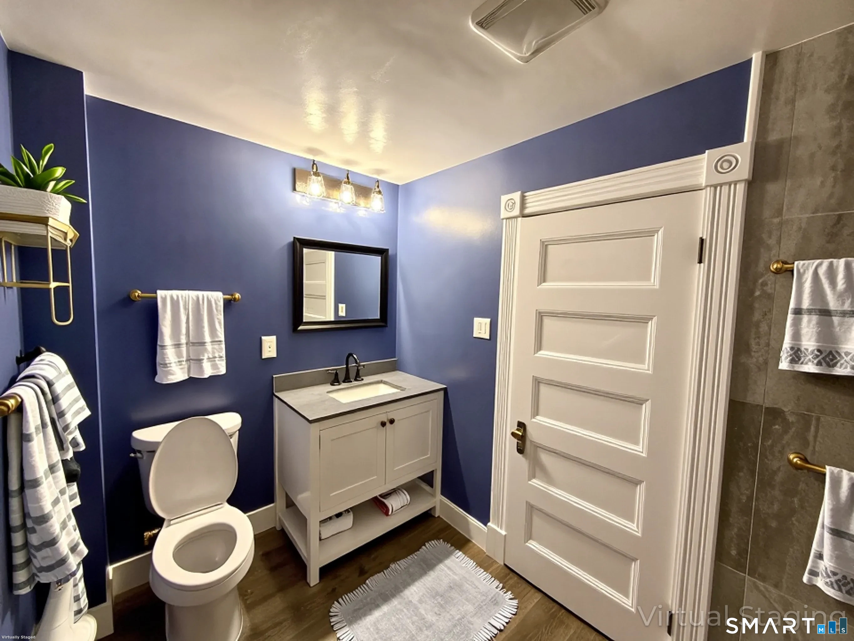 80 North Street Windham, CT 06226 - Photo 13 of 16 a bathroom with a toilet mirror and vanity