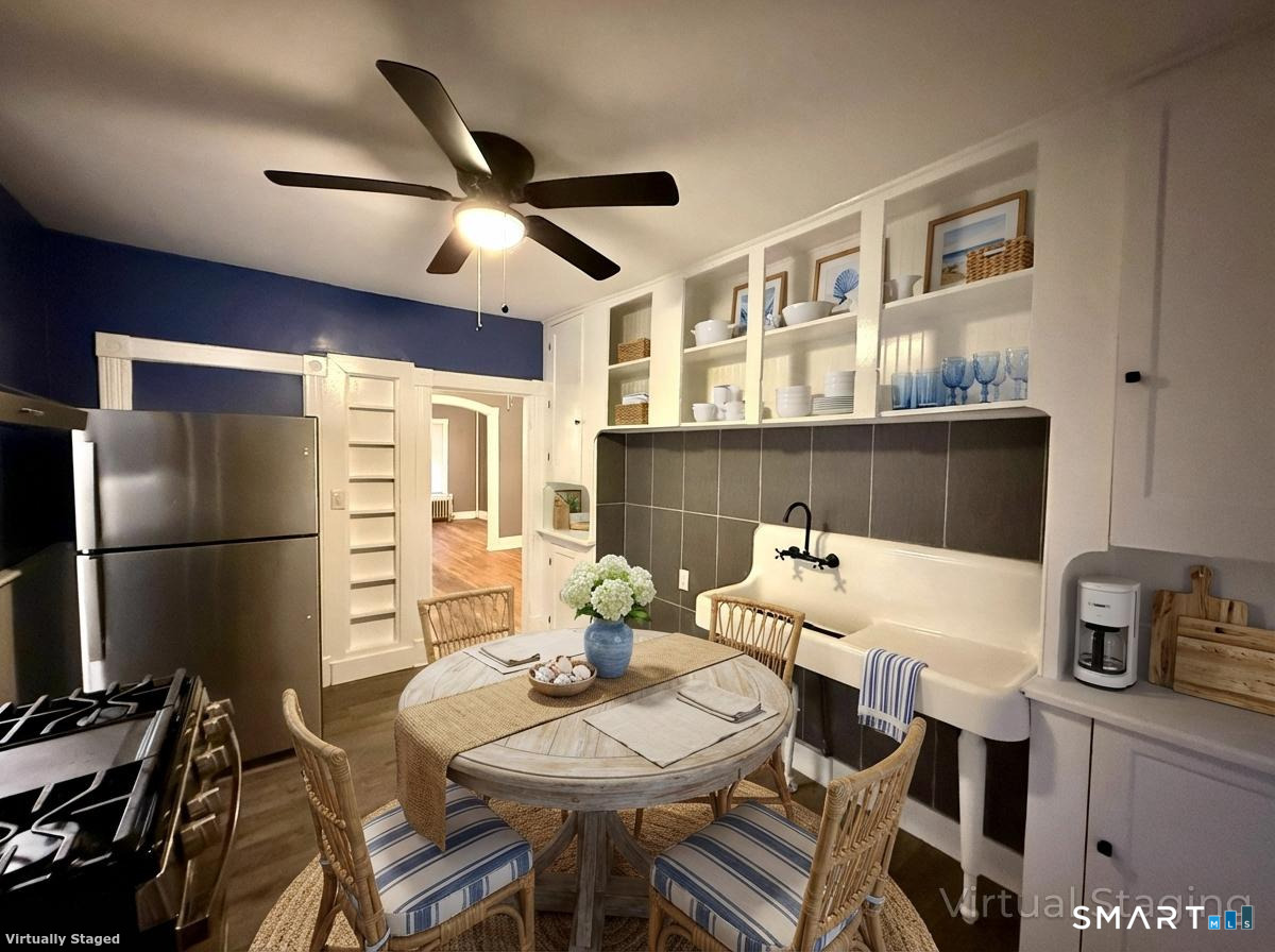 80 North Street Windham, CT 06226 - Photo 3 of 16 a view of a dining room with furniture