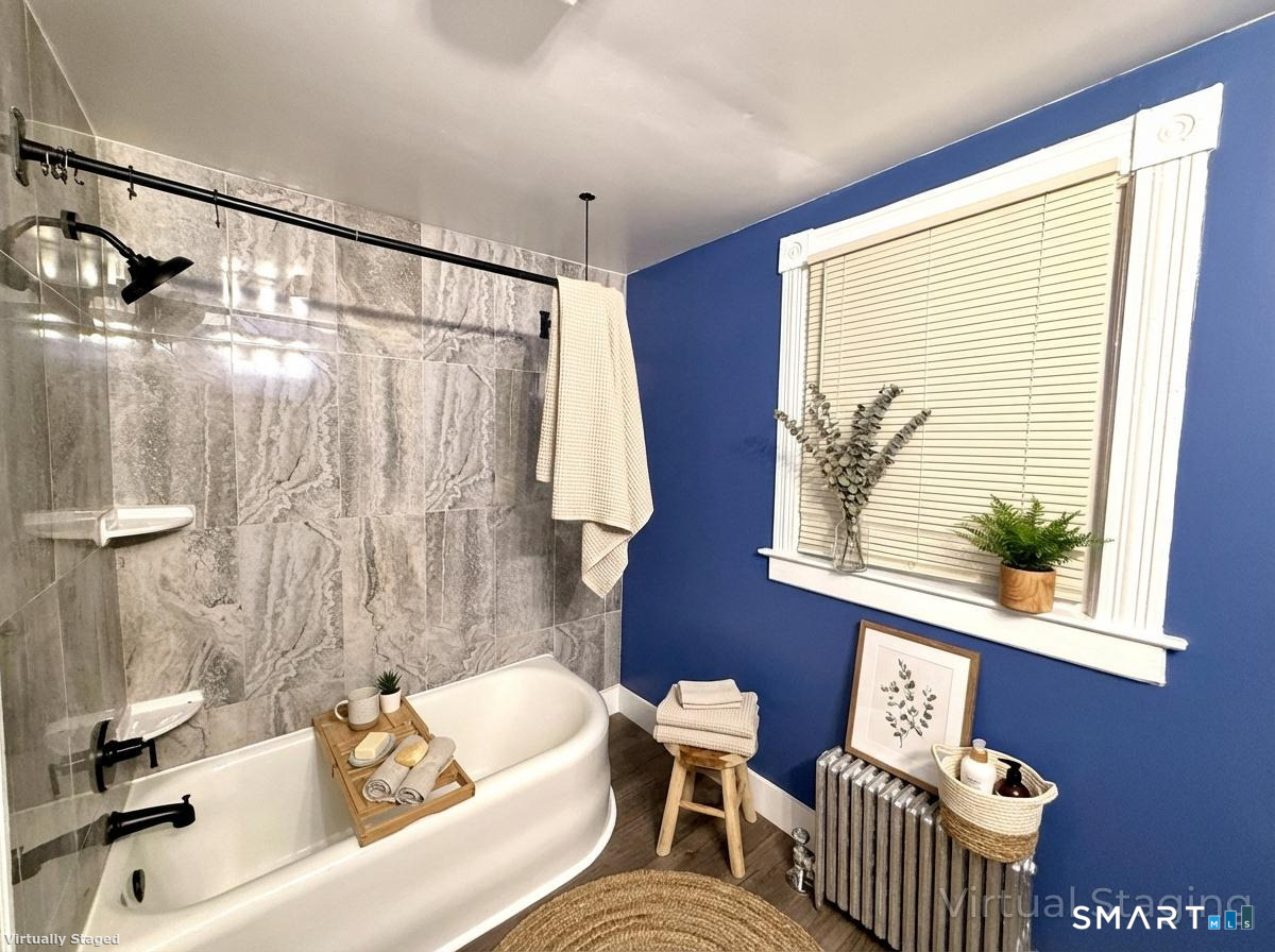 80 North Street Windham, CT 06226 - Photo 7 of 16 a bathroom with a sink and a bathtub