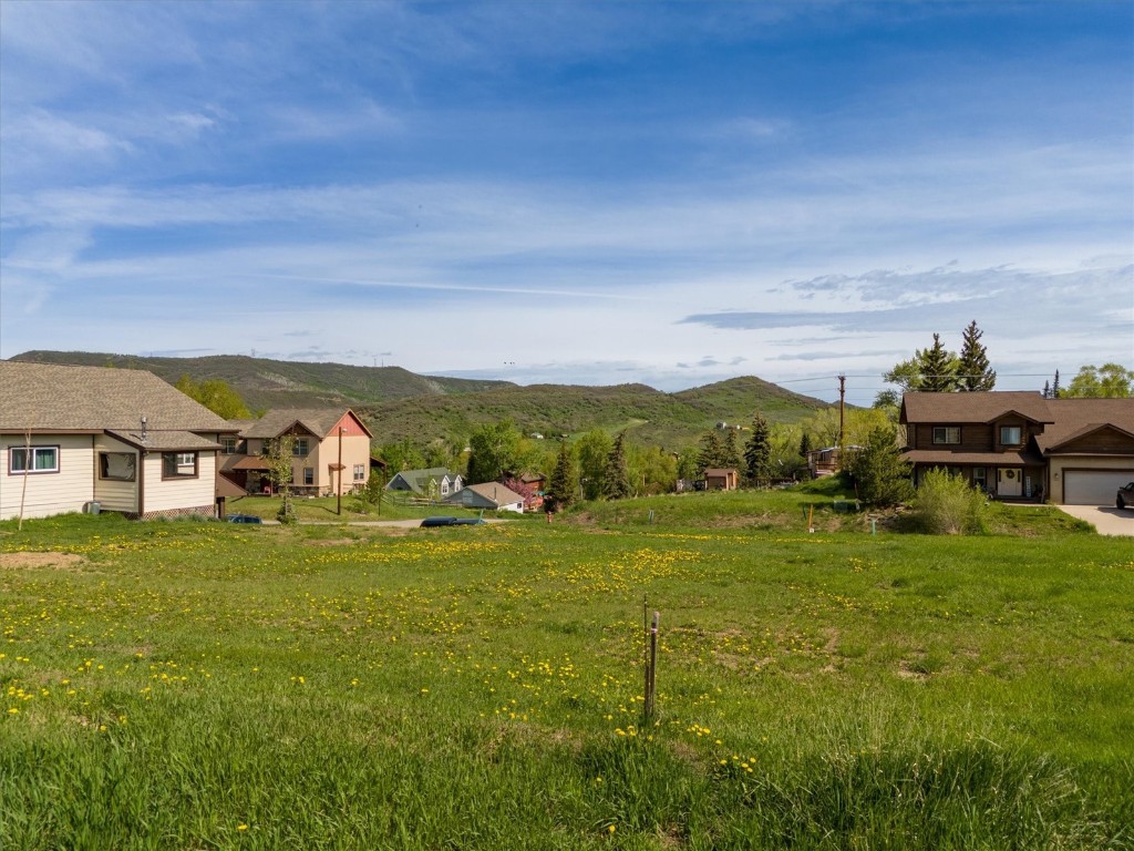 140 Oak Ridge Drive Oak Creek, CO 80467 - Photo 9 of 14 a balcony with grassy field and mountains