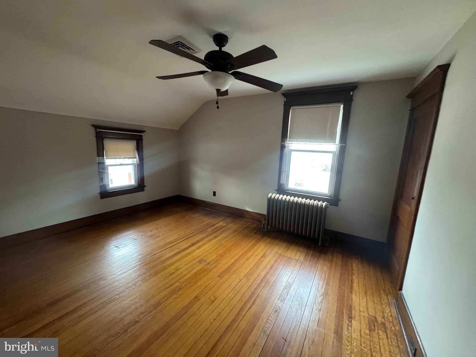 307 Edgewood Avenue Delanco, NJ 08075 - Photo 2 of 13 an empty room with wooden floor and windows