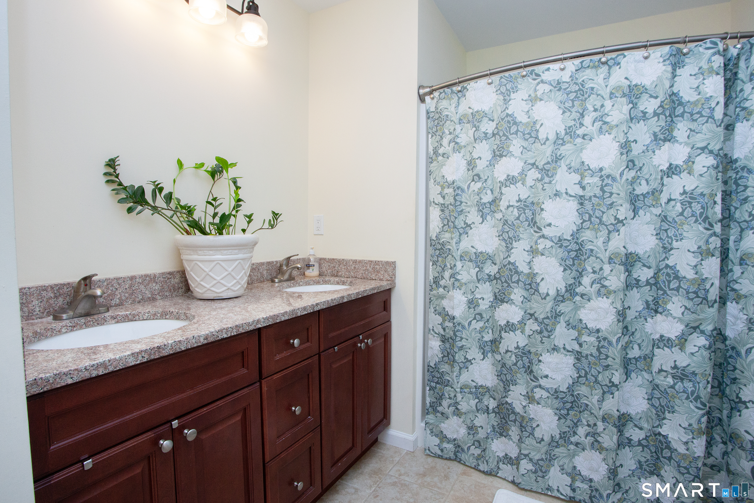 3 Hannah Way Torrington, CT 06790 - Photo 13 of 23 a room with a granite countertop sink and a potted plant