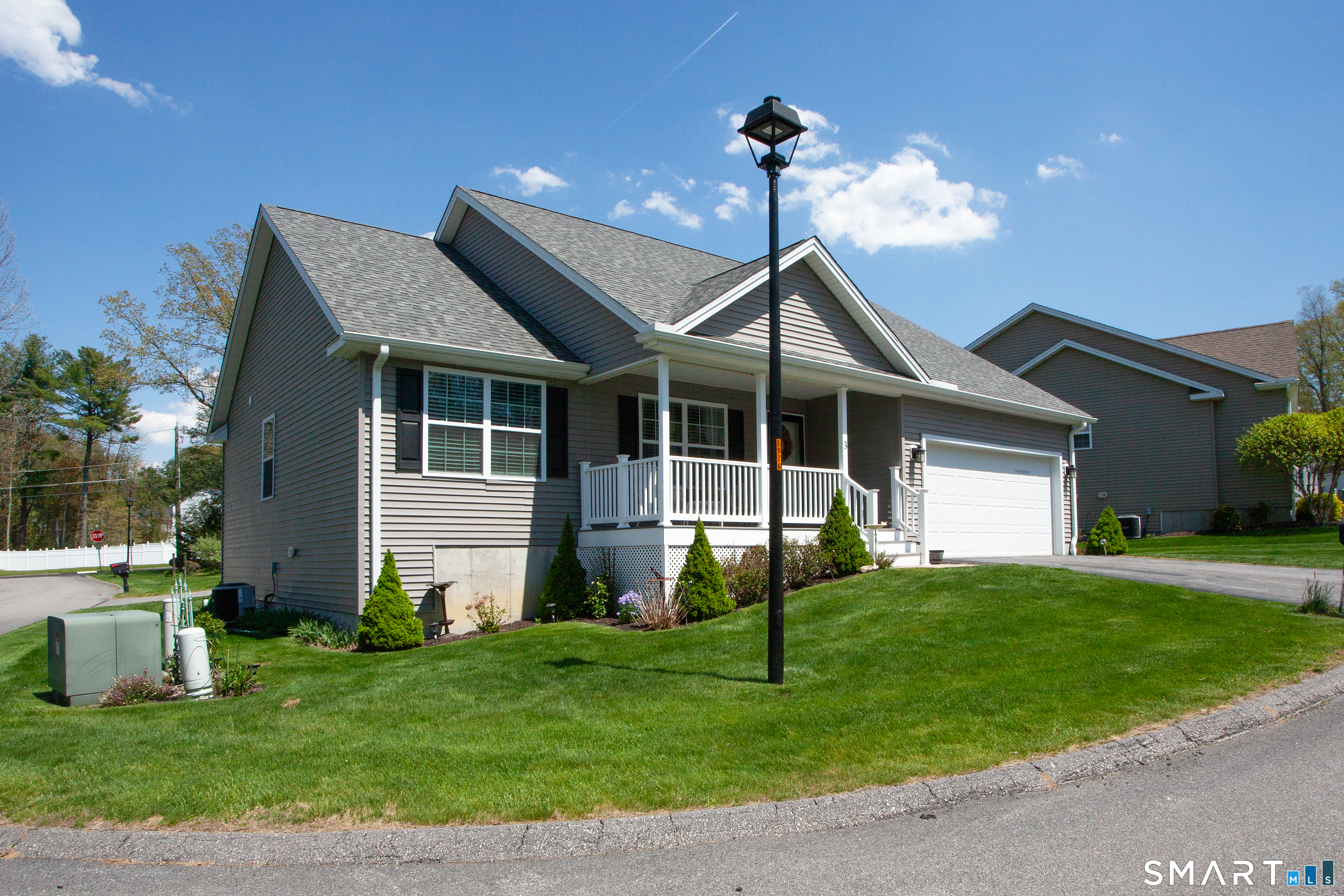 3 Hannah Way Torrington, CT 06790 - Photo 2 of 23 a front view of a house with a garden and yard