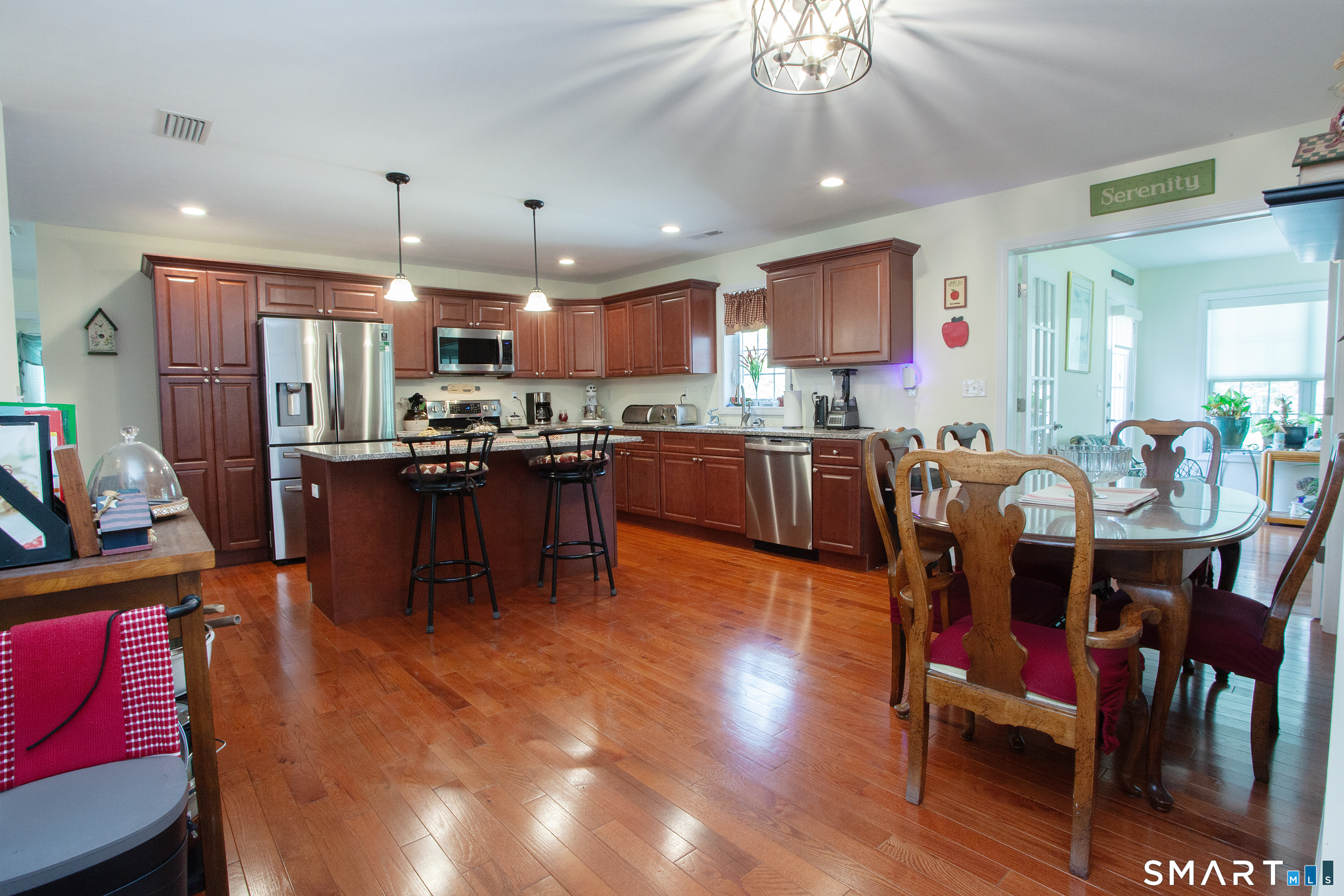 3 Hannah Way Torrington, CT 06790 - Photo 3 of 23 a dining room with stainless steel appliances kitchen island granite countertop a dining table chairs and a oven