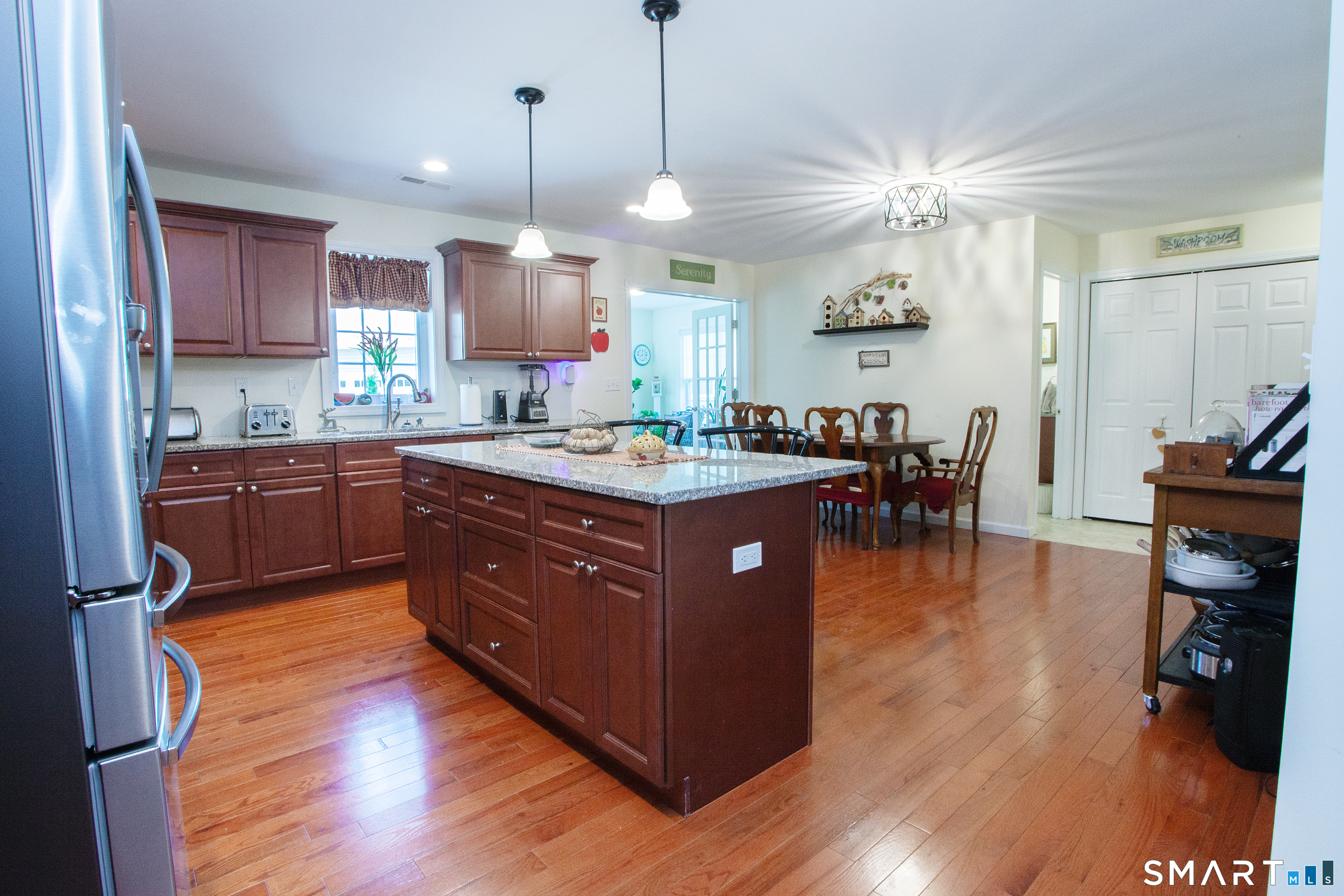 3 Hannah Way Torrington, CT 06790 - Photo 5 of 23 a kitchen with wooden cabinets and sink