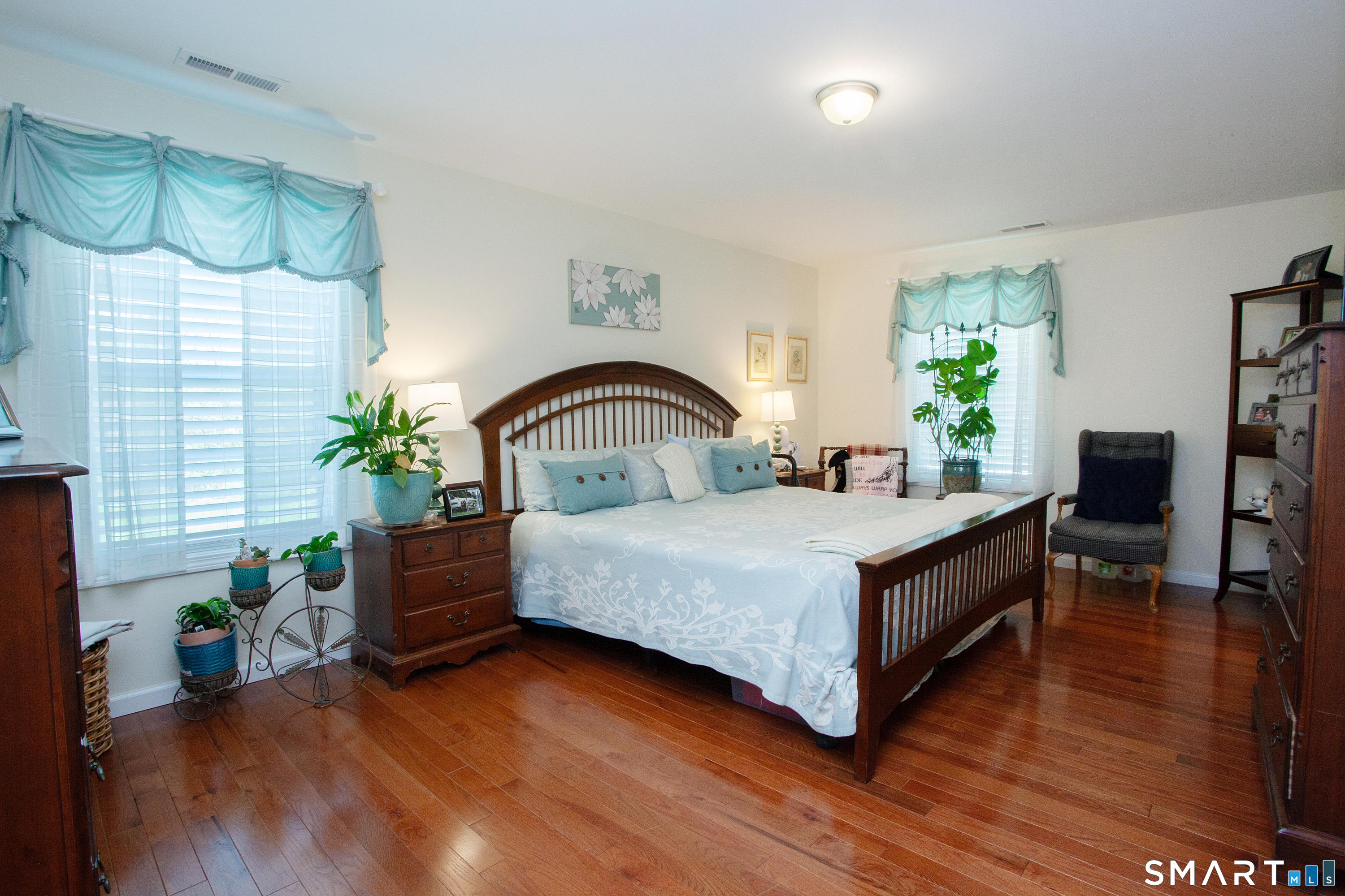 3 Hannah Way Torrington, CT 06790 - Photo 10 of 23 a bedroom with a bed lamp and a potted plant