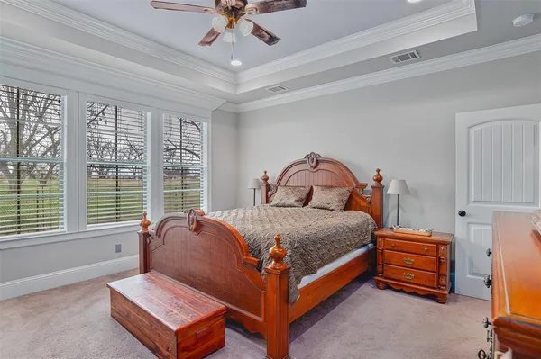 a bed room with a bed and a window