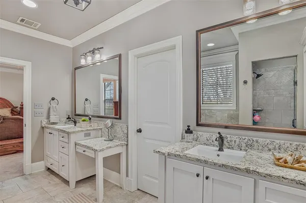 a bathroom with a sink double vanity and a mirror
