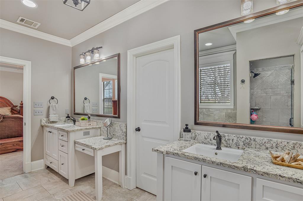 106 Pear Tree Lane Benton, LA 71006 - Photo 16 of 26 a bathroom with a sink double vanity and a mirror