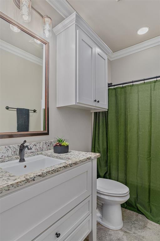 106 Pear Tree Lane Benton, LA 71006 - Photo 21 of 26 a bathroom with a granite countertop sink a toilet and a mirror