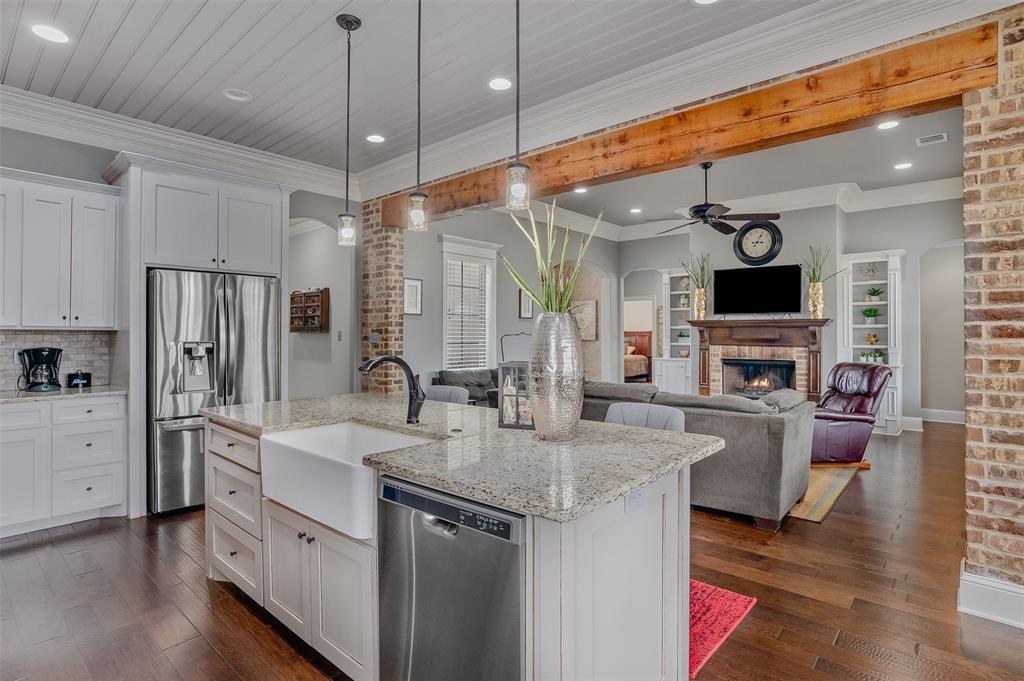 106 Pear Tree Lane Benton, LA 71006 - Photo 10 of 26 a kitchen with stainless steel appliances granite countertop a sink and refrigerator