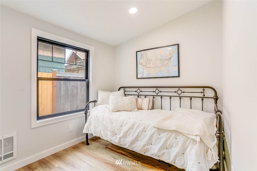 1108 North 41st Street Seattle, WA 98103 - Photo 20 of 32 a large bed sitting in a bedroom next to a window