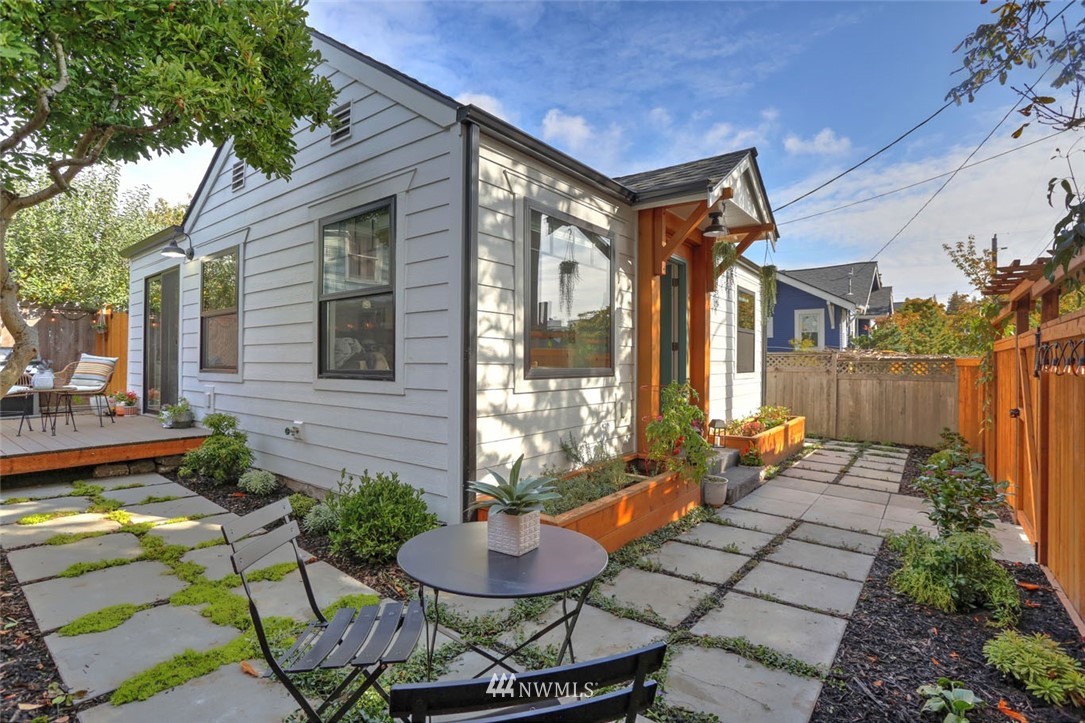 1108 North 41st Street Seattle, WA 98103 - Photo 24 of 32 a backyard of a house with outdoor seating