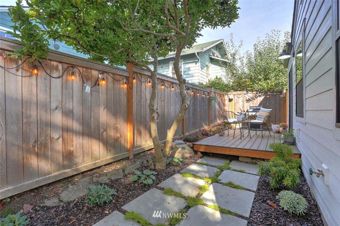 1108 North 41st Street Seattle, WA 98103 - Photo 29 of 32 a view of a backyard with sitting area