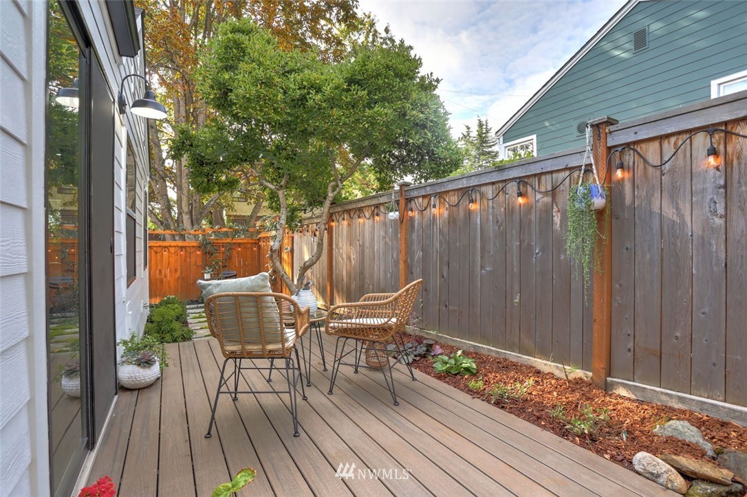 1108 North 41st Street Seattle, WA 98103 - Photo 32 of 32 a balcony with wooden floor table and chairs