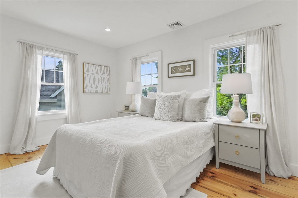 224 Elm Street Amesbury, MA 01913 - Photo 13 of 29 a bedroom with a large bed and a window