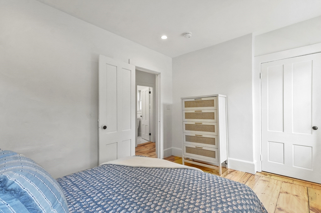 224 Elm Street Amesbury, MA 01913 - Photo 18 of 29 a bedroom with a bed and a walk in closet