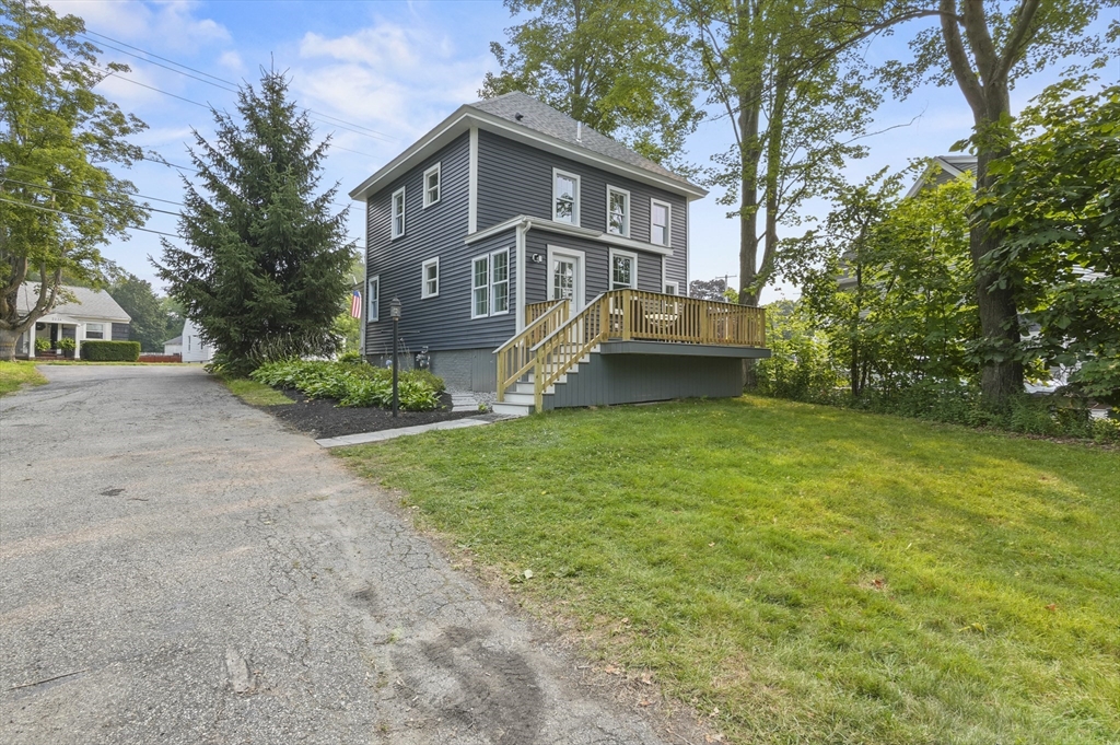 224 Elm Street Amesbury, MA 01913 - Photo 24 of 29 a front view of a house with garden