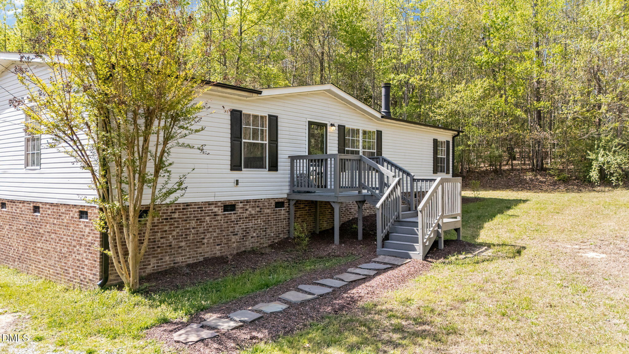 721 General Green Road Kittrell, NC 27544 - Photo 3 of 36 a view of a house with a yard chairs and iron fence