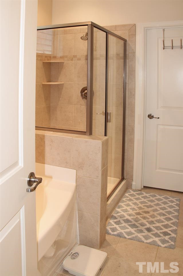 1300 Rodessa Run Raleigh, NC 27607 - Photo 13 of 16 a bathroom with a shower and a toilet