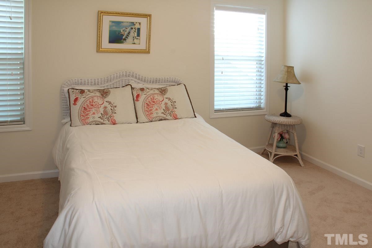 1300 Rodessa Run Raleigh, NC 27607 - Photo 14 of 16 a bedroom with a bed and a desk