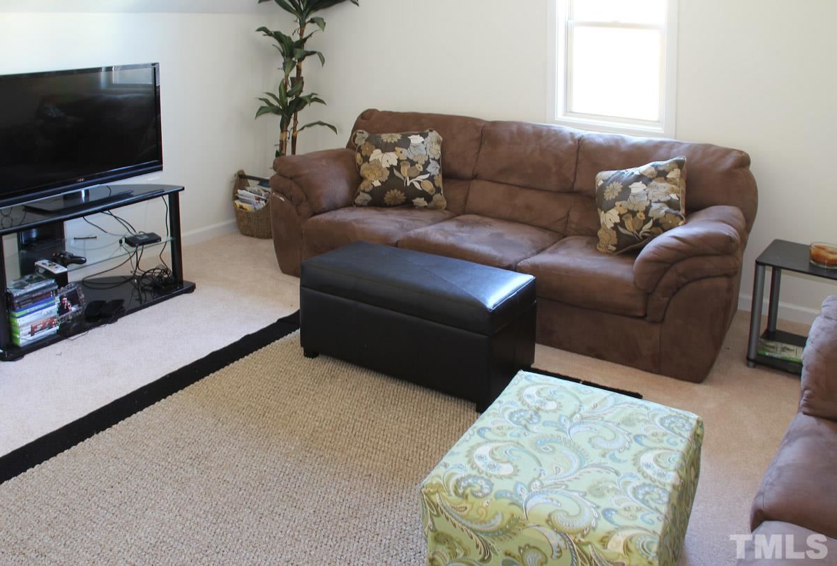 1300 Rodessa Run Raleigh, NC 27607 - Photo 15 of 16 a living room with furniture and a flat screen tv