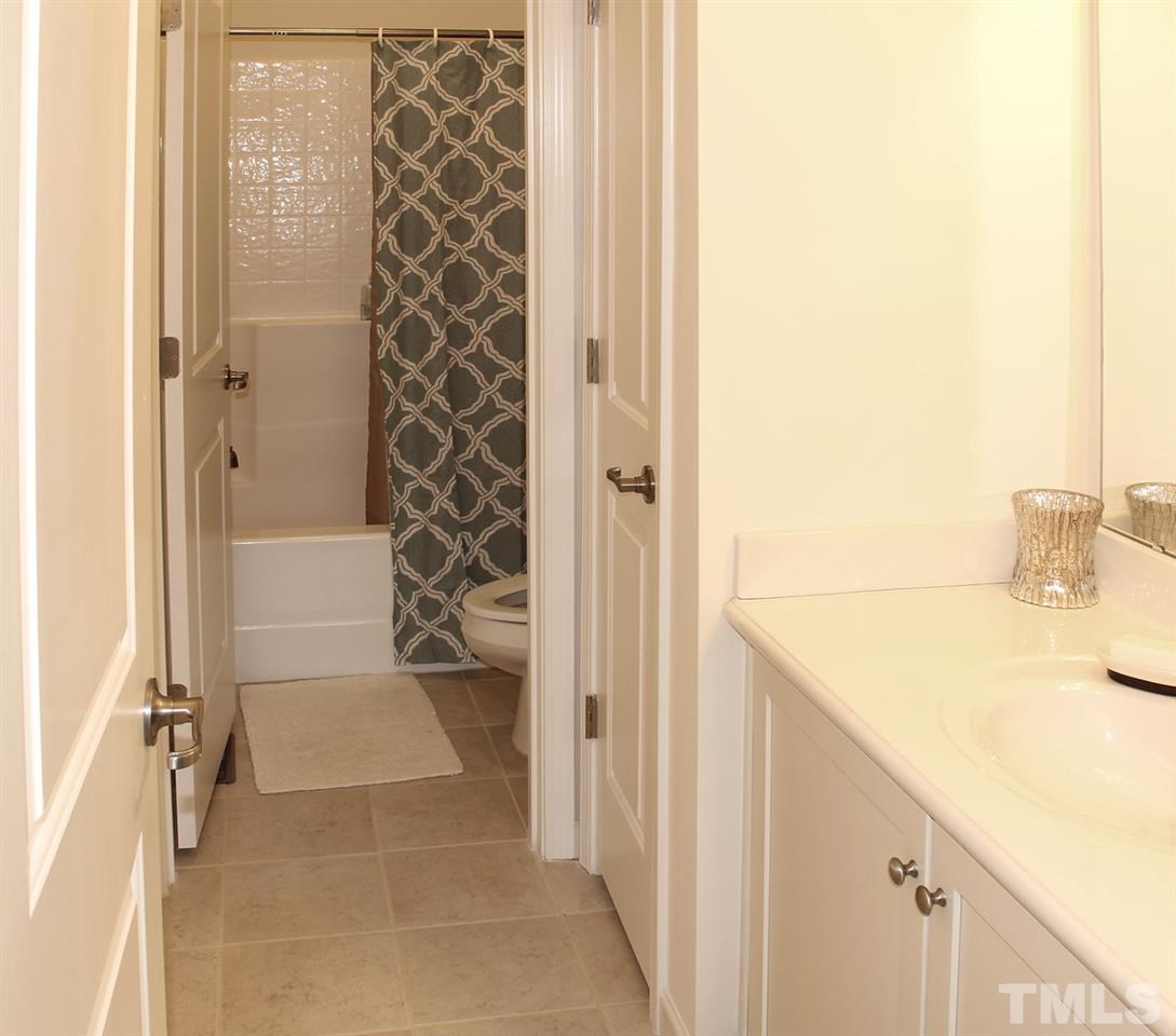 1300 Rodessa Run Raleigh, NC 27607 - Photo 16 of 16 a bathroom with a sink and a shower