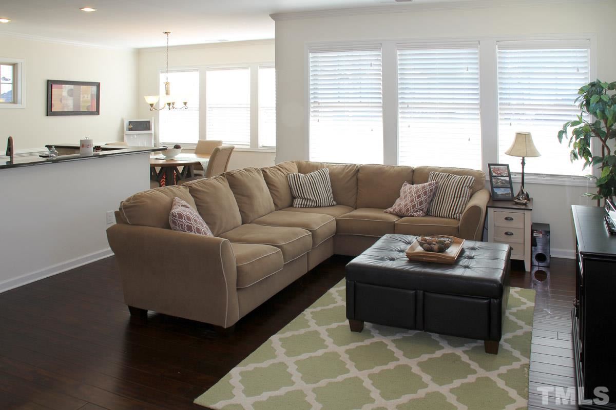 1300 Rodessa Run Raleigh, NC 27607 - Photo 3 of 16 a living room with furniture and a large window