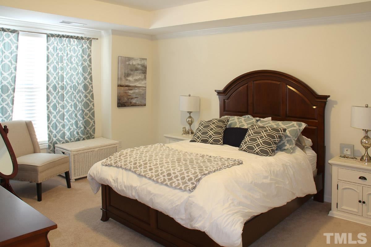 1300 Rodessa Run Raleigh, NC 27607 - Photo 10 of 16 a bedroom with a bed and a window