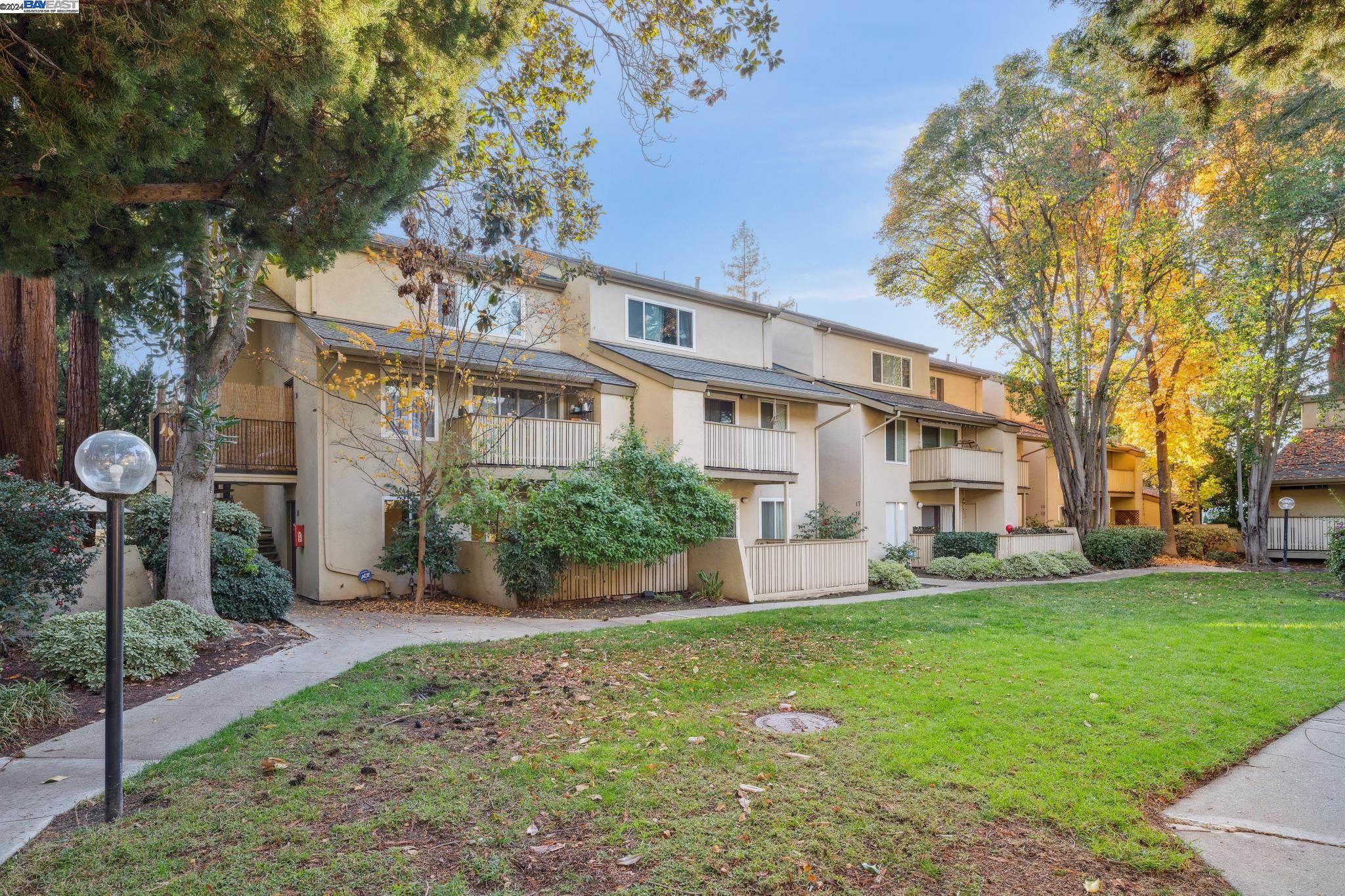 2700 Oak Road, Unit 20 Walnut Creek, CA 94597 - Photo 1 of 1 a front view of a house with garden