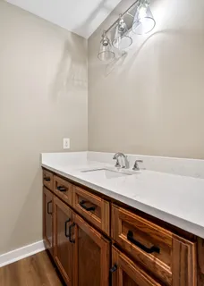 a view of a sink and cabinets