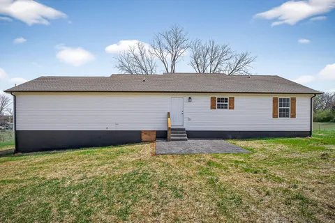 a view of a back yard of the house
