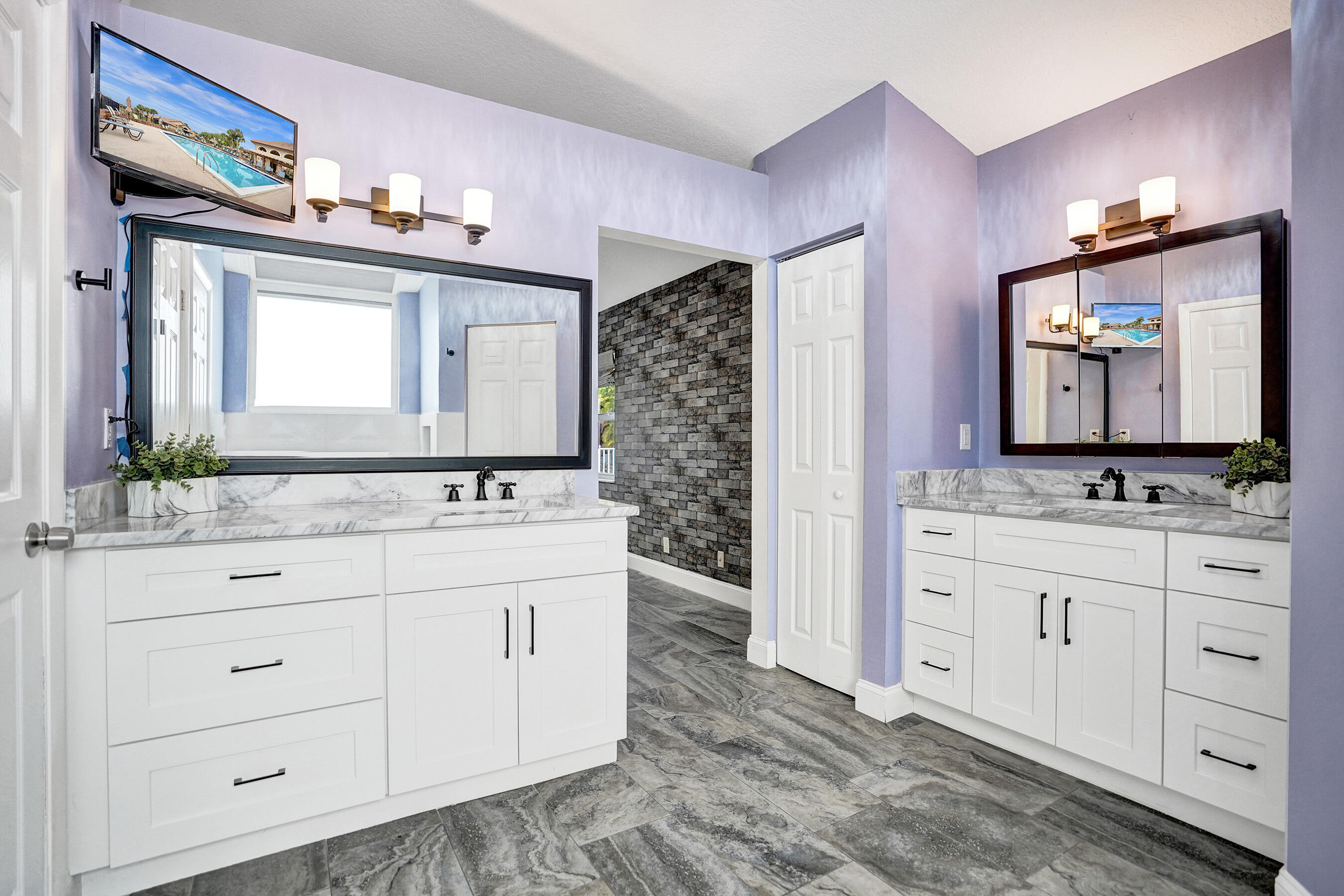 8062 Cassia Drive Boynton Beach, FL 33472 - Photo 22 of 70 a bathroom with a sink vanity and mirror