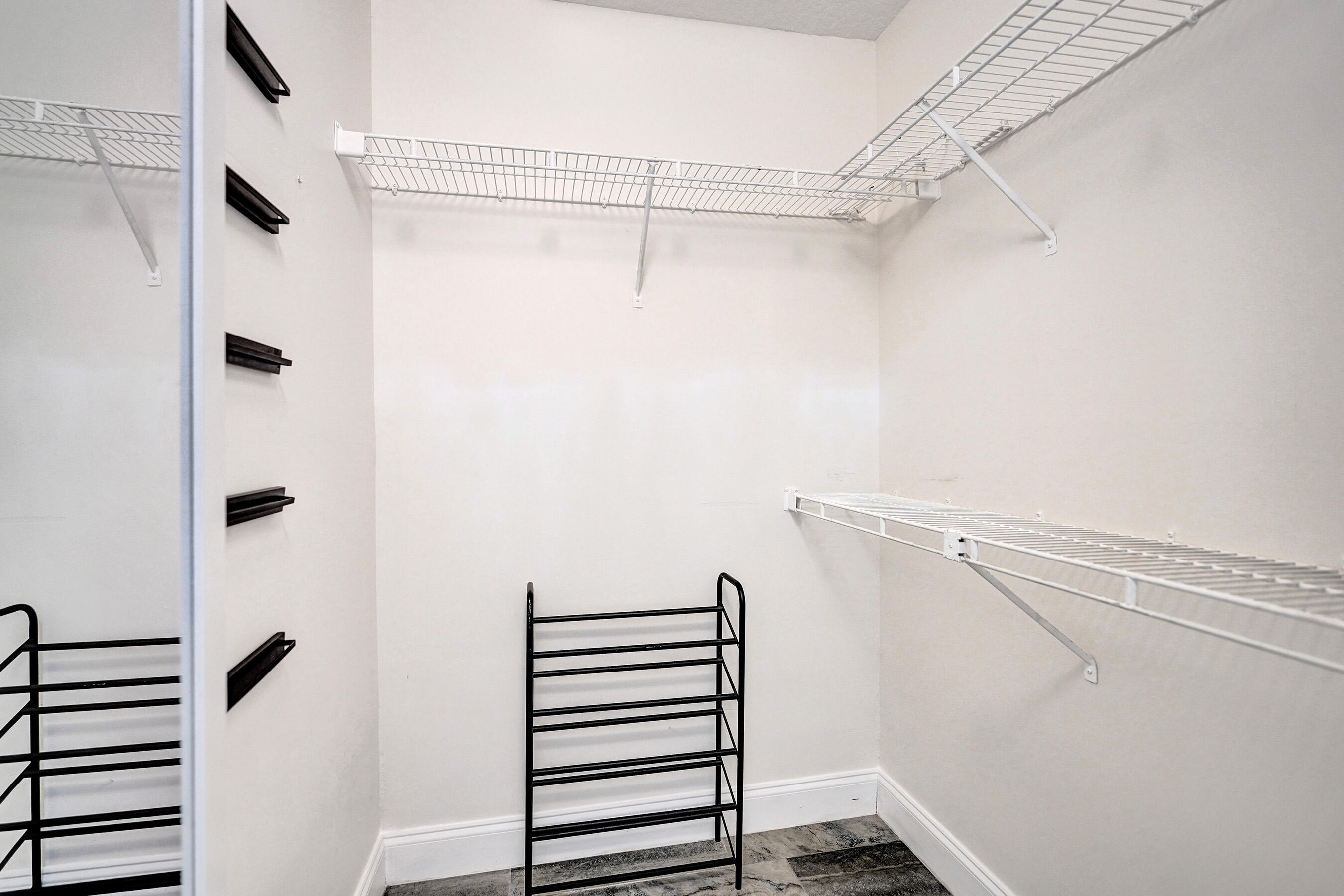 8062 Cassia Drive Boynton Beach, FL 33472 - Photo 28 of 70 a view of walk in closet with empty racks