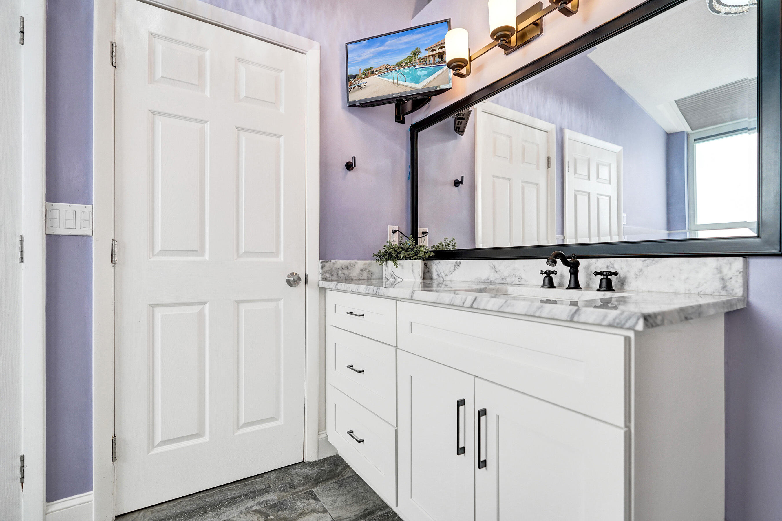 8062 Cassia Drive Boynton Beach, FL 33472 - Photo 31 of 70 a bathroom with a sink and a mirror