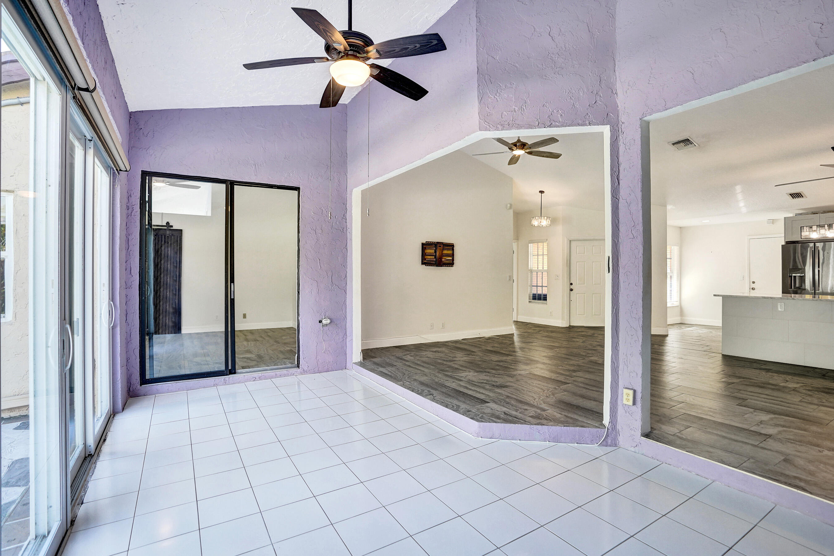 8062 Cassia Drive Boynton Beach, FL 33472 - Photo 32 of 70 a view of a hallway view with wooden floor and a ceiling fan