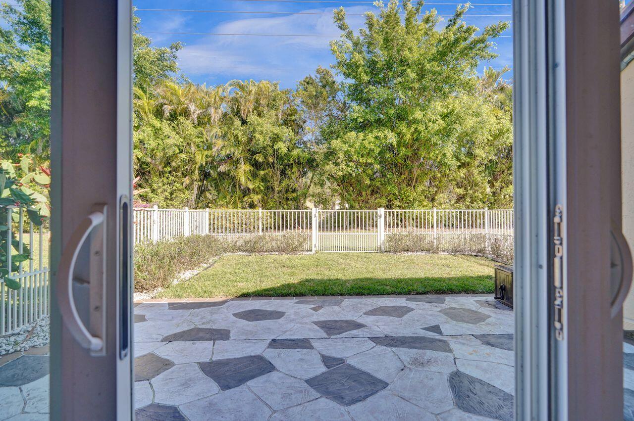 8062 Cassia Drive Boynton Beach, FL 33472 - Photo 34 of 70 a view of a yard with an outdoor space