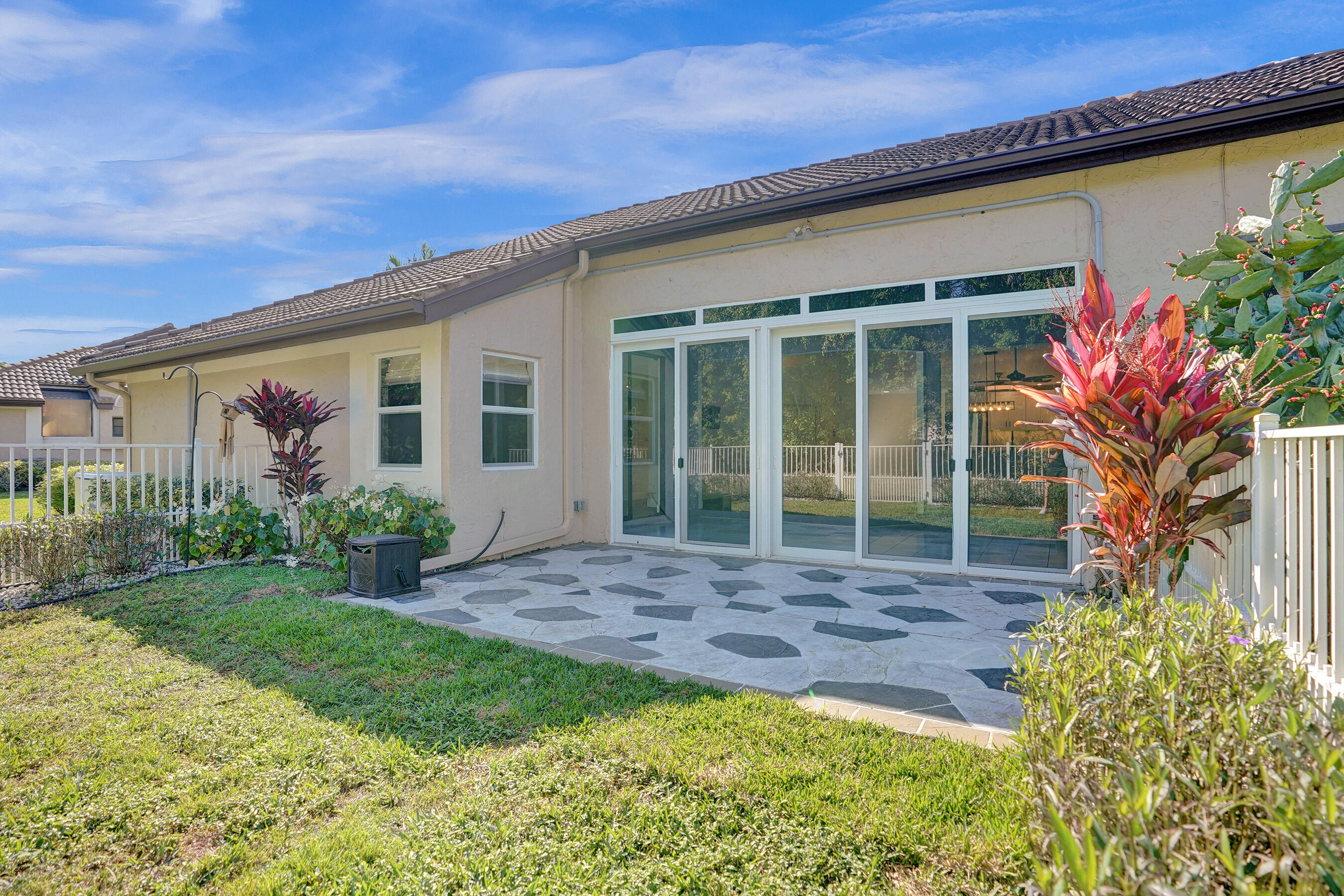 8062 Cassia Drive Boynton Beach, FL 33472 - Photo 36 of 70 a view of a house with backyard and garden