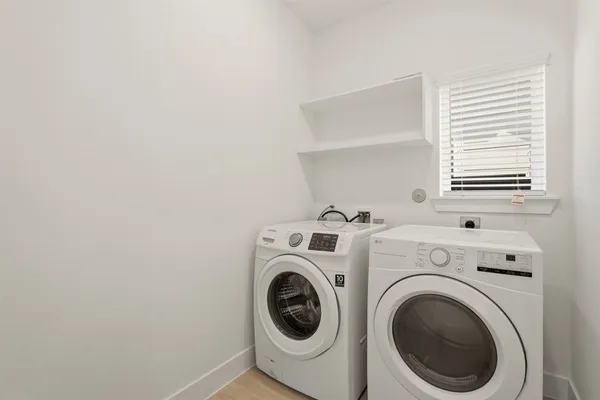 a utility room with dryer and washer