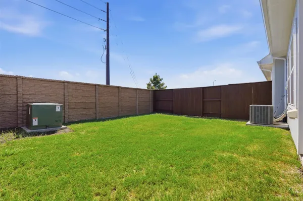 a view of a backyard with potted plants