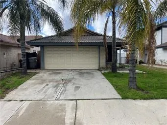 front view of house with palm trees