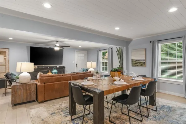 a view of a dining room with furniture and window