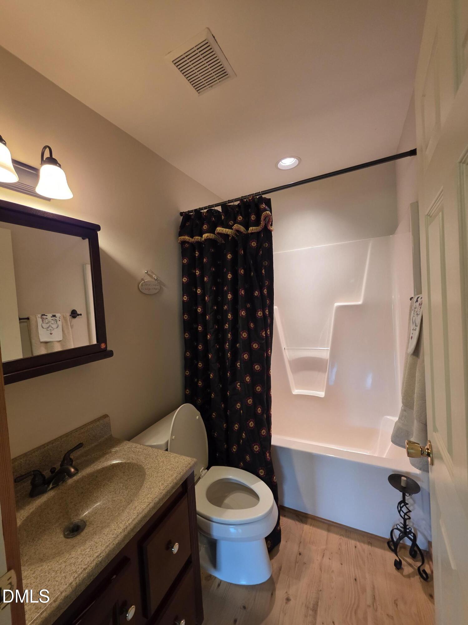 413 Johnson Town Road Zebulon, NC 27597 - Photo 20 of 42 a bathroom with a sink toilet and shower