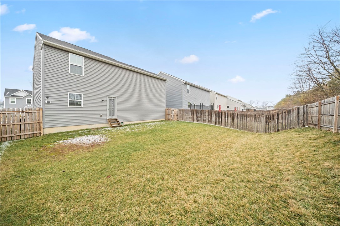 226 Golden Gate Avenue Springfield, OH 45506 - Photo 19 of 20 This spacious yard features a sturdy fence, offering ample room for outdoor activities.