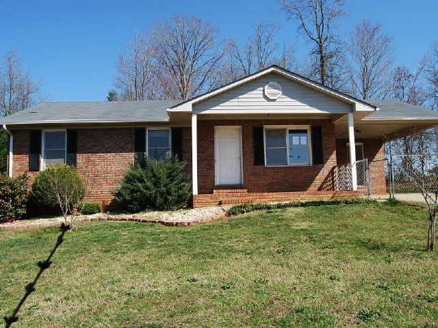 727 Dorsey Road Cleveland, GA 30528 - Photo 1 of 1 a front view of a house with a yard