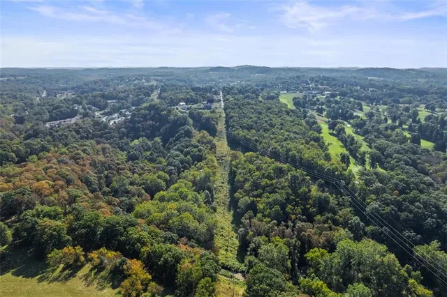 an aerial view of residential house and outdoor space