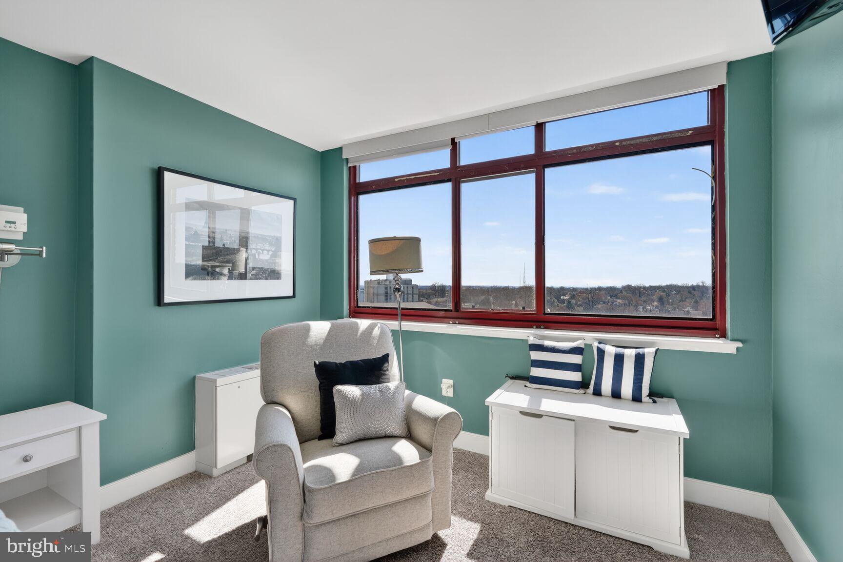 1220 Blair Mill Road, Unit 1403 Silver Spring, MD 20910 - Photo 20 of 40 a living room with furniture and a large window