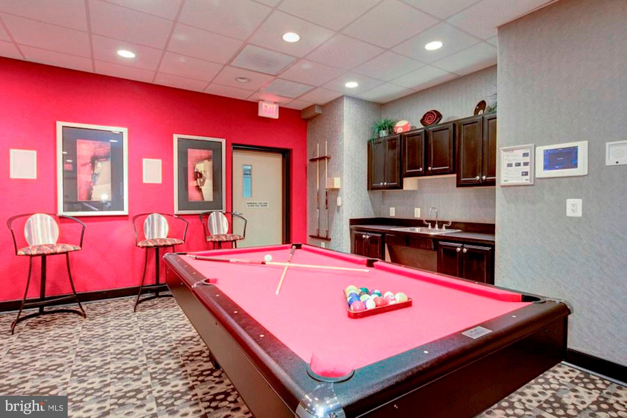 1220 Blair Mill Road, Unit 1403 Silver Spring, MD 20910 - Photo 31 of 40 a room with pool table and flat screen tv