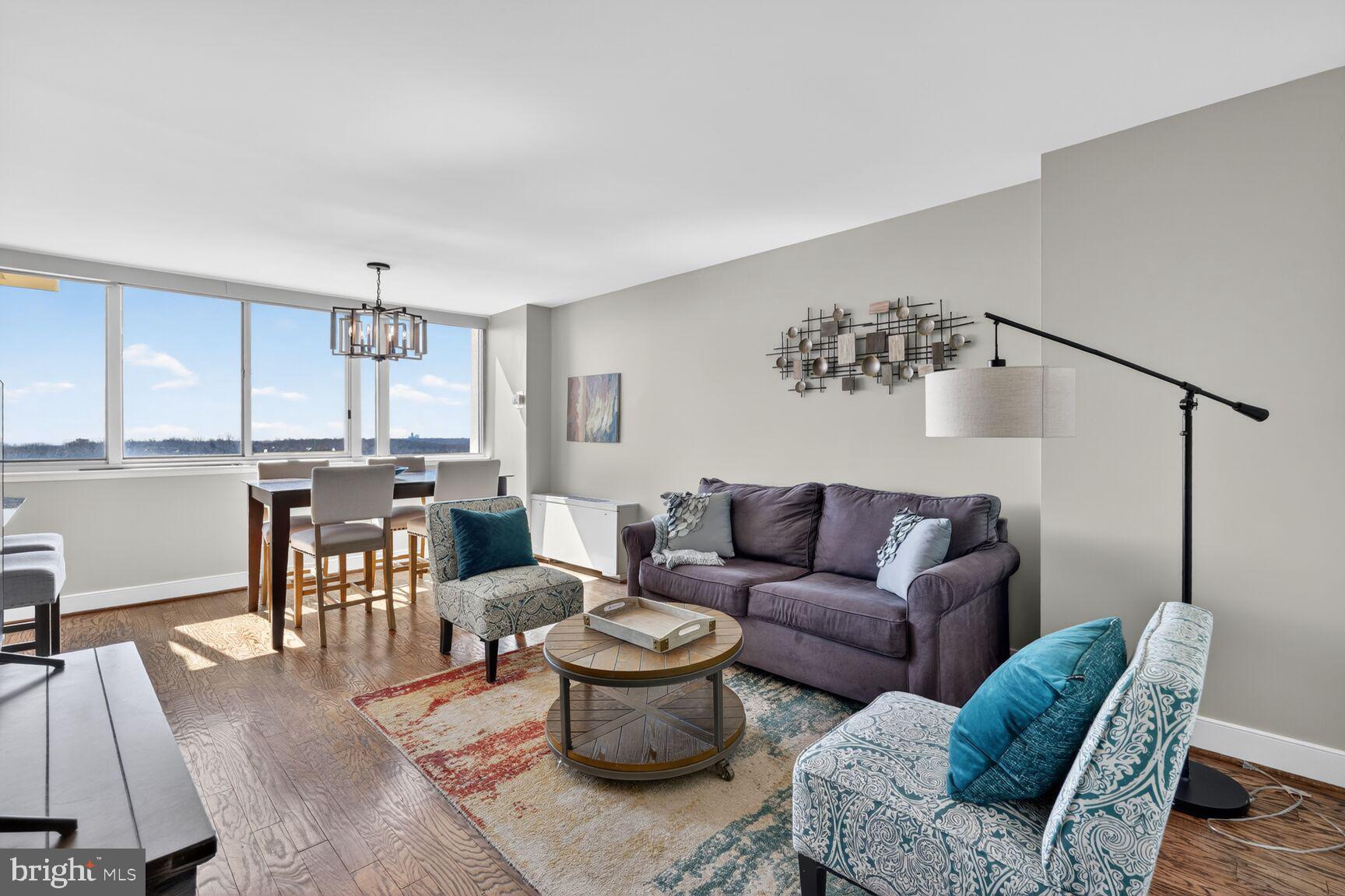 1220 Blair Mill Road, Unit 1403 Silver Spring, MD 20910 - Photo 5 of 40 a living room with furniture and wooden floor