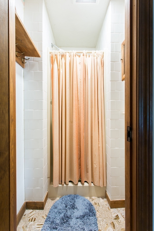 9 Birch Hill Road West Brookfield, MA 01585 - Photo 18 of 38 a bathroom with a window and a bathtub